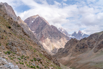 The beautiful view of blue sky and snow mountain summit near to Zmeya peak in Fann mountains in Tajikistan