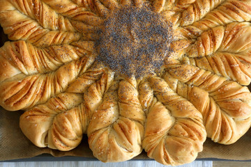Homemade pull apart cheesy bread on a table. Top view.