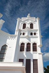 Fototapeta na wymiar White towers on an old Episcopal church in Key West, Florida