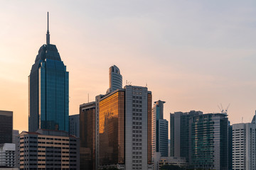 Fototapeta na wymiar Panoramic view of Kuala Lumpur skyline at sunset. City center of capital of Malaysia. Contemporary buildings exterior with glass.