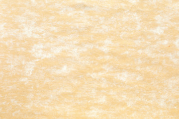 Old yellow paper with white stain  