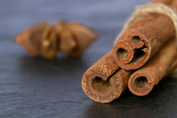 Cinnamon sticks on grey background, closeup. Macro. 