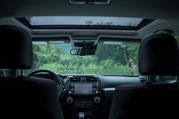 Luxury car in the rainny nature