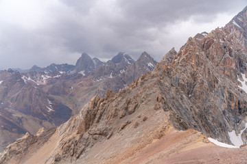 The beautiful view of blue sky and snow mountain summit near to Zmeya peak in Fann mountains in Tajikistan
