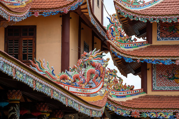 Colorful dragon sculpture on the roof In a Buddhist temple in Danang, Vietnam