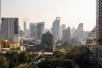 Obraz premium Panoramic view of Bangkok skyline at sunset. Modern city center of capital of Thailand. Contemporary buildings exterior with glass.
