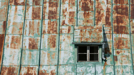old tin roof with window