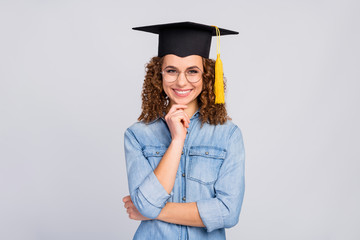 Photo of attractive wavy clever lady got master degree finished university tassel head finger on chin wear specs casual denim blue shirt isolated grey color background