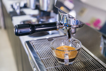 Coffee in a glass distilled from a coffee machine