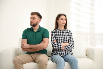 Stubborn man and woman with problems in relationship at home