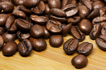 Roasted coffee beans close up background