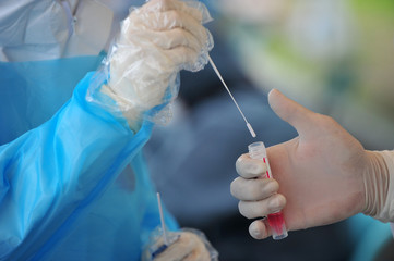 Taking a swab for corona virus sample in South Korea.