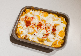 Freshly baked homemade potato casserole, which is a traditional hungarian meal.