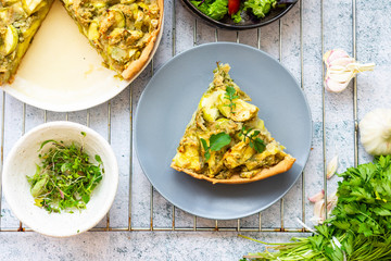 Vegetable casserole or tart with potato and zucchini. Vegan healthy food.