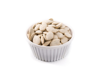 Pumpkin seeds in bowl isolated on white background