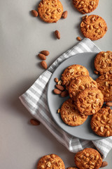 Cookies the top view. The gray plate with a stripe. Breakfast on every day.
