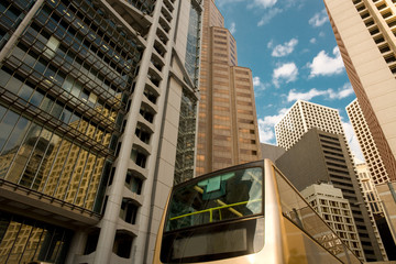 Fototapeta na wymiar Bus at Des Voeux Road and skyline of buildings at Central District, Hong Kong Island, Hong Kong, China, Asia