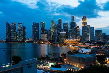 Fototapeta premium Picturesque panoramic view of Singapore city at sunset. Financial and trading center hub in Asia region. Concept of success. Modern buildings in high-tech world.