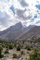Fototapeta premium The beautiful mountain trekking road with clear blue sky and rocky hills in Fann mountains in Tajikistan