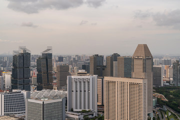 Fototapeta premium Picturesque panoramic view of Singapore city at sunset. Financial and trading center hub in Asia region. Concept of success. Modern buildings in high-tech world.