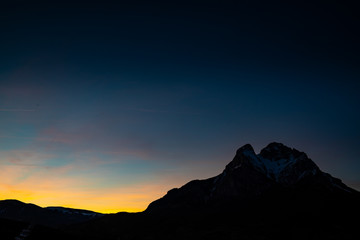 Peak of Pedraforca in Catalonia snowed with clear sky during sunset