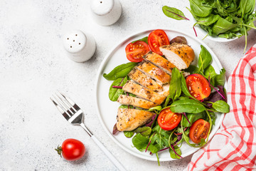 Chicken fillet with salad top view.