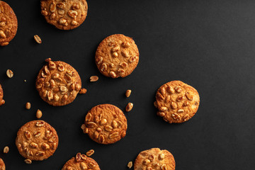 Cookies with nuts on a dark background and copy space. The view from the top on the table. VIP Breakfast.