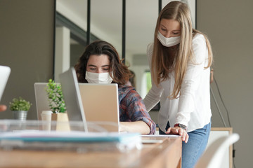 group of students working wearing masks