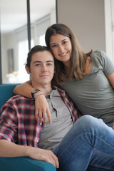 Fototapeta premium young couple smiling facing camera