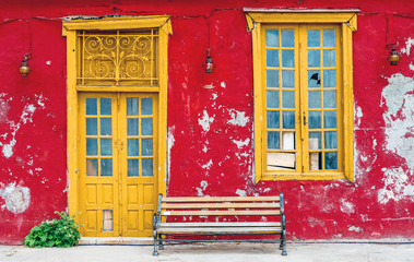 Hydra, Attica / Greece - June 6, 2010: Abandoned and colorful house with a bench in the old village...