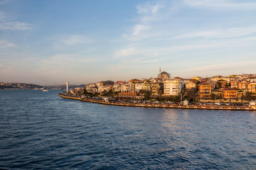 View of the Uskudar district of Istanbul from the Bosphorus at sunset. Turkey