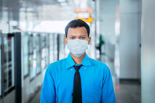 Male Employee Wears Mask On Quiet MRT Station