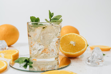 Sliced orange fruit segments isolated on white, lemonade