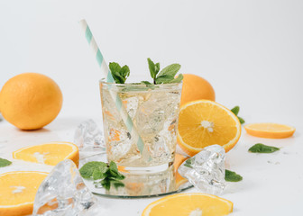 Sliced orange fruit segments isolated on white, lemonade