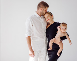 Happy Young Family in Studio