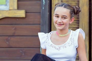 portrait of a young girl in a summer park.
