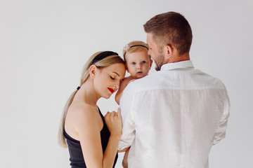 Happy Young Family in Studio