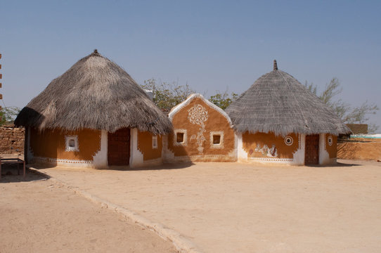 Khuri village with traditional-style hut with clay-and-dung walls and thatched roofs,  Jaisalmer, Rajasthan, India