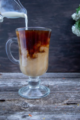 coffee with milk in a glass transparent cup