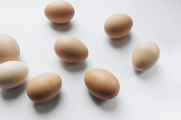 Fototapeta na wymiar chicken eggs in cardboard package on white background