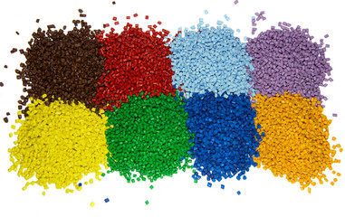 Multi colored plastic polymer granules isolated on white 