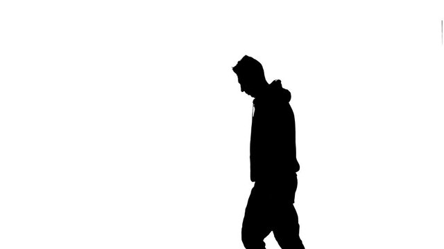 black silhouette on a white background, young energetic guy dancing hip hop, freestyle, street dance. Medium long shot