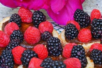 Raspberry and blackberry tarts on apple donuts