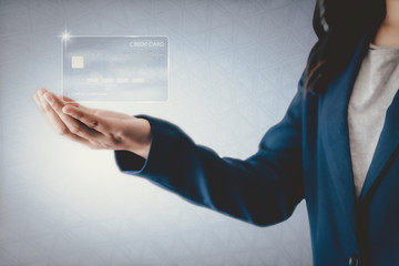 Futuristic Credit Card Banking and Business Financial Concept, Business Woman Holding Electronic...