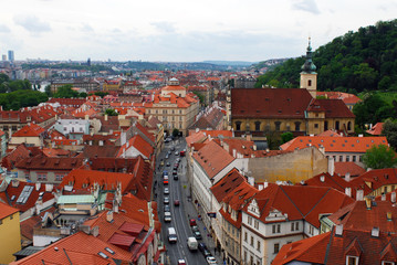 Fototapeta na wymiar Red tile roofs in Check republic capital - Prague from hills in city