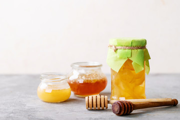 Glass cup of black tea served with honey