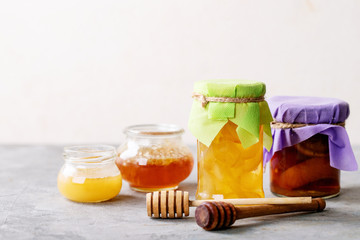 Glass cup of black tea served with honey