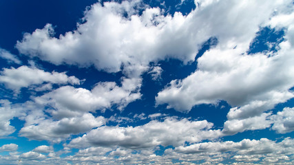 Blue sky with white clouds. Beautiful background.