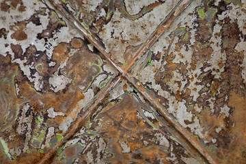 
texture of an old metal cabinet with old paint rust metal bolts