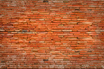 Brick wall of orange brown color, old heritage style. Aged and ruined wall background.